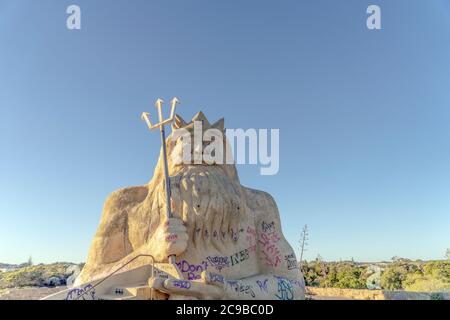 King Neptune statue in Atlantis Marine Park in Two Rocks, Western Australia. Perth's Abandoned Theme Park. Stock Photo