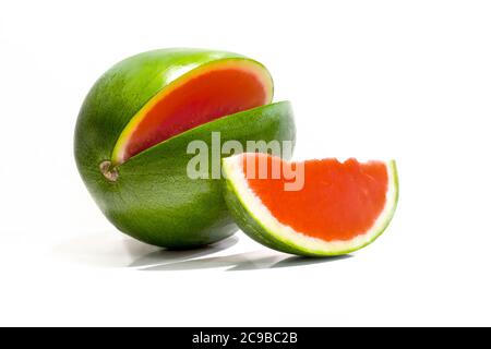 Fresh seedless wedge cut watermelon and one watermelon slice isolated on white background Stock Photo