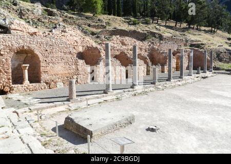 The ruins in Delphi, an archaeological site in Greece at the Mount Parnassus. Delphi is famous by the oracle at the sanctuary dedicated to Apollo. UNE Stock Photo