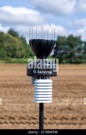 Sencrop Raincrop V14 agricultural weather station equipment in farm field, Sutton, Suffolk, England, UK Stock Photo