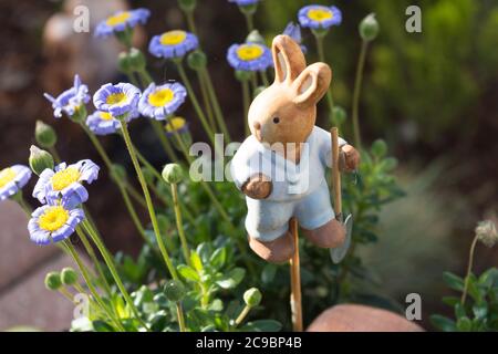 Easter decoration flowers decorated with a small wooden bunny Stock Photo