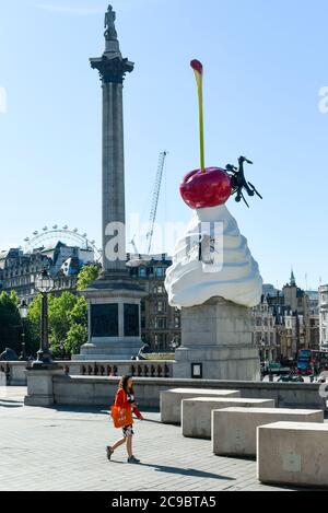 London, UK.  29 July 2020.  Artist Heather Phillipson's 'THE END', is unveiled to the public as the new Fourth Plinth artwork in Trafalgar Square.  THE END shows a giant swirl of replica whipped cream topped with a cherry, a fly and a drone.  Its drone transmits a live feed of the square which can be watched on a dedicated website.  The installation, originally planned for 26 March 2020 but postponed due to the coronavirus pandemic, will remain on display for the next year two years.  Credit: Stephen Chung / Alamy Live News Stock Photo