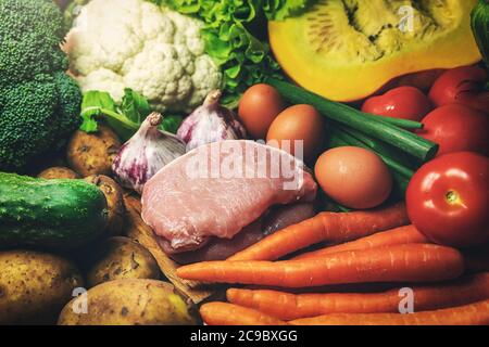 fresh healthy organic food from local farmer- group of vegetables, meat and eggs Stock Photo