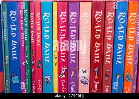 Closeup of colourful Roald Dahl book covers, spines, illustrations and artwork