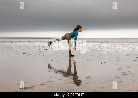 Shanagarry, Cork, Ireland. 30th July, 2020. Personel trainer Zoe McCurdy doing her early morning workout on Ardnahinch Beach near Shanagarry, Co. Cork, Ireland.- Credit; David Creedon / Alamy Live News Stock Photo