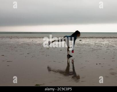 Shanagarry, Cork, Ireland. 30th July, 2020. Personel trainer Zoe McCurdy doing her early morning workout on Ardnahinch Beach near Shanagarry, Co. Cork, Ireland.- Credit; David Creedon / Alamy Live News Stock Photo