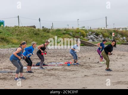 Shanagarry, Cork, Ireland. 30th July, 2020. Ladies from East Cork take part in an early morning workout under instruction from personal trainer Zoe McCurdy at Ardnahinch Beach near Shanagarry, Co. Cork, Ireland. - Credit; David Creedon / Alamy Live News Stock Photo