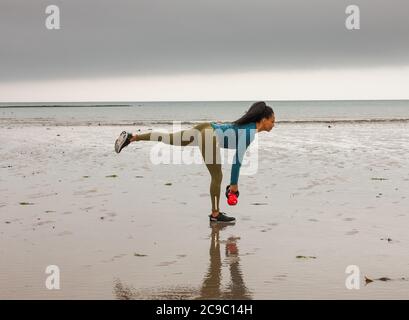 Shanagarry, Cork, Ireland. 30th July, 2020. Personel trainer Zoe McCurdy doing her early morning workout on Ardnahinch Beach near Shanagarry, Co. Cork, Ireland.- Credit; David Creedon / Alamy Live News Stock Photo