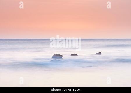 sunset on the coast of Cadiz in the atlantic ocean. Andalusia, Spain Stock Photo