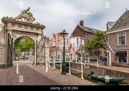 Leiden, Netherlands - July 22, 2020: Gate Doelenpoort and Doelen canal in the old city center of Leiden in the Netherlands, Europe Stock Photo