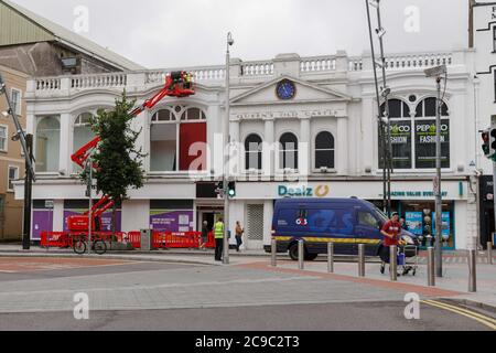 Cork, Ireland. 30th July 2020. Queens Old Castle, Cork City. Workers painting the former Argos Unit at Queens Old Castle Cork. Credit: Damian Coleman/Alamy Live News Stock Photo