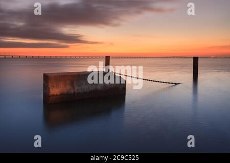 Lisbon at sunrise with Vasco da Gama Bridge in the background. Portugal is a great travel destination in Europe for its light and its monuments. Amazi Stock Photo