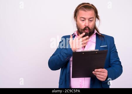 Bearded businessman with mustache and long hair against white background Stock Photo