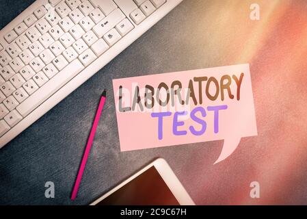 Handwriting text writing Laboratory Test. Conceptual photo Determination of a medical diagnosis from the substances tested Paper accesories with digit Stock Photo