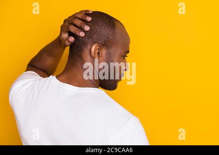 Close-up rear back behind view portrait of his he nice attractive serious guy touching hairdo care skincare neat grooming service isolated over bright Stock Photo