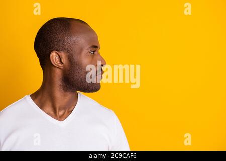 Close-up profile side view portrait of his he nice attractive calm content serious guy shaven beard groomed hairstyle isolated over bright vivid shine Stock Photo