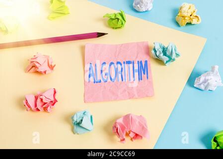 Conceptual hand writing showing Algorithm. Concept meaning procedure for solving a problem or accomplishing tasks etc. Colored crumpled papers empty r Stock Photo