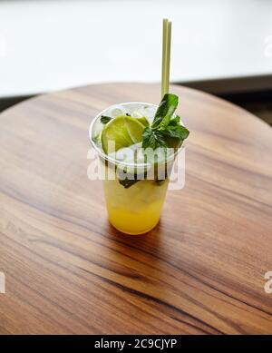 Mojito cocktail or soda drink with lime and mint on table in bar.Blurred image,selective focus Stock Photo