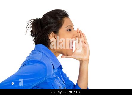 Side view profile portrait of mad, angry young woman yelling, screaming with hand to mouth gesture isolated on white background. Negative emotions Stock Photo