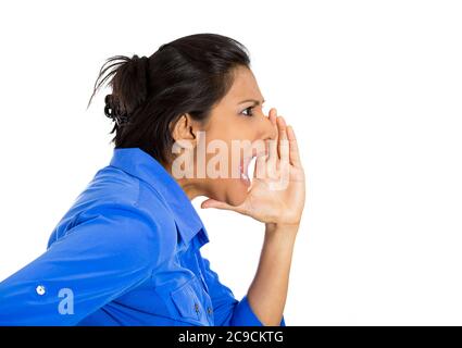 Side view profile portrait of mad, angry young woman yelling, screaming with hand to mouth gesture isolated on white background. Negative emotions Stock Photo