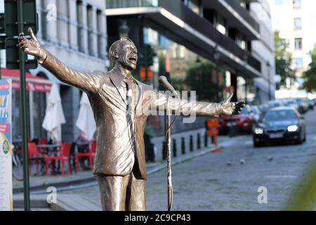 Brussels, Belgium - statue of Jacques Brel famous Belgian singer, writer and actor at the Place de la Vieille Halle aux Blés by artist Tom Frantzen Stock Photo