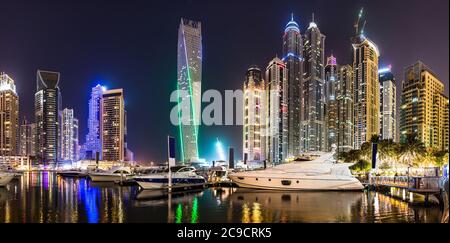Dubai downtown night scene with city lights, luxury new high tech town in middle East. Dubai Marina cityscape, UAE. Stock Photo