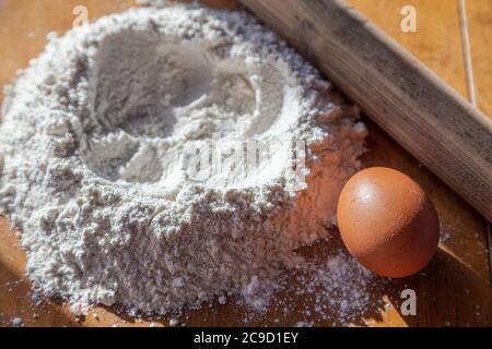 flour, egg, rolling pin on the table. Cooking concept. High quality photo Stock Photo