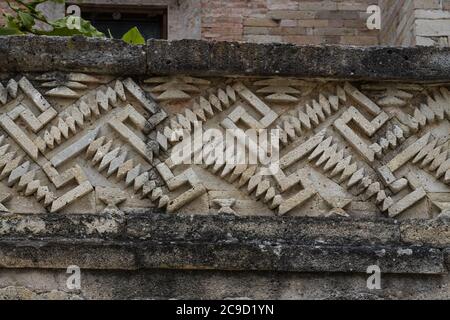 Detail of the stone fretwork panels  in Courtyard B (Quadrangle B) the ruins of the Zapotec city of Mitla, Oaxaca, Mexico.  A UNESCO World Heritage si Stock Photo