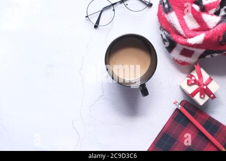 flat composition coffee, notepad and eyeglass on white background . Stock Photo