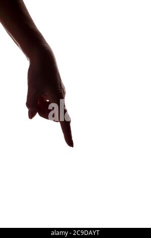 female hand pointing down - vertical silhouette, concept Stock Photo