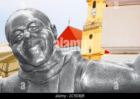 BRATISLAVA, SLOVAKIA - SEPTEMBER 01, 2019: The statue of Schoner Naci by Kaffee Mayer on Main square Stock Photo