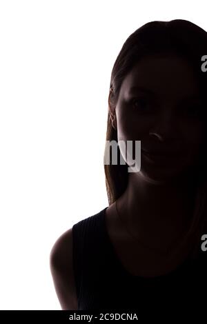 Young woman look ahead with flowing hair - vertical, isolated silhouette of a front view Stock Photo