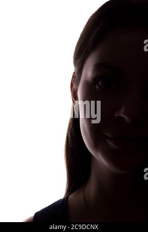 Young woman look ahead with flowing hair - vertical, isolated silhouette of a front view Stock Photo