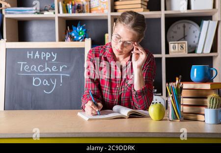 Formal education. Teacher pretty woman enjoy educational process in classroom. Teachers day.  (Soft focus on girl) Stock Photo