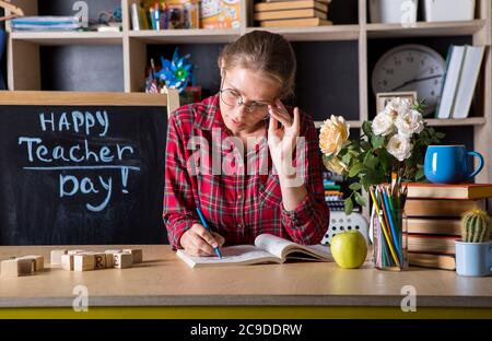 Formal education. Teacher pretty woman enjoy educational process in classroom. Teachers day.  (Soft focus on girl) Stock Photo