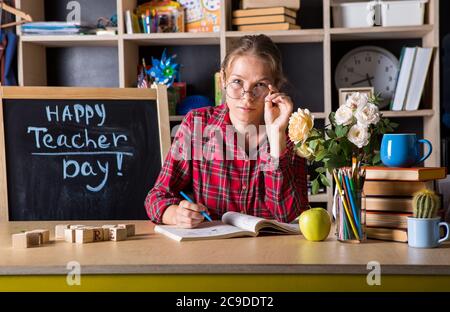 Formal education. Teacher pretty woman enjoy educational process in classroom. Teachers day.  (Soft focus on girl) Stock Photo