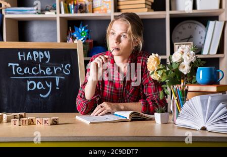 Formal education. Teacher pretty woman enjoy educational process in classroom. Teachers day.  (Soft focus on girl) Stock Photo