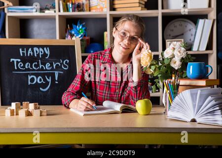 Formal education. Teacher pretty woman enjoy educational process in classroom. Teachers day.  (Soft focus on girl) Stock Photo