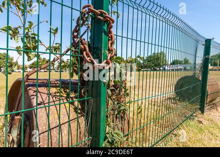 Chalkwell Park in Westcliff on Sea, Southend, Essex, UK. Southend on Sea Borough Council green space in an urban area.Cricket pitch rollers chained up Stock Photo