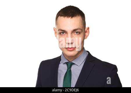 Charming handsome young man. Handsome caucasian man in necktie and suit isolated over white background. Stock Photo