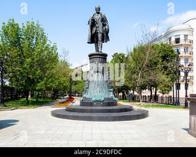 MOSCOW, RUSSIA - JULY 12, 2020: view of Sretensky Boulevard with monument to Shukhov on Turgenevskaya Square in Moscow city. The monument was created