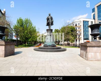 MOSCOW, RUSSIA - JULY 12, 2020: view of Sretensky Boulevard with statue of Shukhov on Turgenevskaya Square in Moscow city. The monument was created by