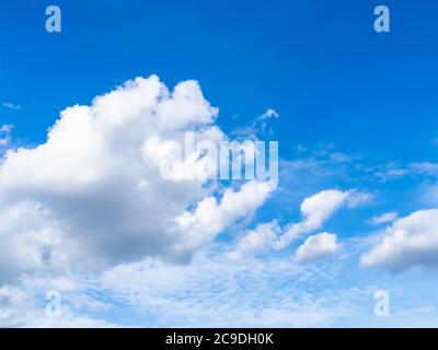 natural background - cumulus white clouds in blue sky over Moscow city in July Stock Photo