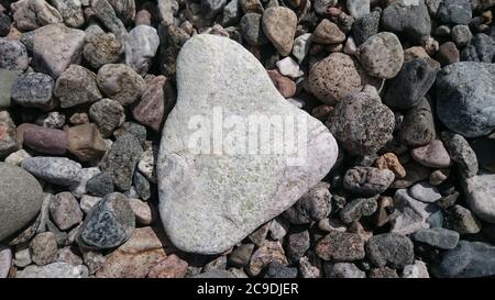 Close up of rounded and polished beach rocks Stock Photo
