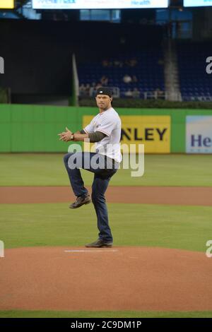 Miami, United States. 14th Aug, 2014. MIAMI, FL - AUGUST 13: Expendables 3 stars Antonio Banderas and Kellan Lutz throw out the first pitch at the St. Louis Cardinals vs. the Miami Marlins at Marlins Park on August 13, 2014 in Miami, Florida. Credit: Storms Media Group/Alamy Live News Stock Photo