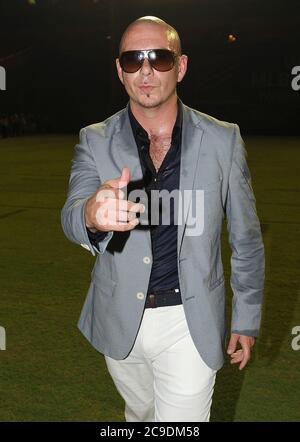 MIAMI GARDENS, FL - SEPTEMBER 04: (EXCLUSIVE COVERAGE) Miami-born, Cuban-American rapper Pitbull (rmando Christian Prez - born January 15, 1981), shows his best John Travolta Saturday Night Fever dance moves in his white pants. Rapper and sometime South Florida resident Fat Joe (AKA Joseph Antonio Cartagena - Born: 19-Aug-1970) opened the show, as part of the MarlinsÕ Super Saturdays program, which provides free post-game concerts during Saturday night home games at Sun Life Stadium in Miami Gardens. Pitbull recently released the unintelligible 'Watagatapitusberry' from his upcoming first S Stock Photo