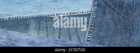 Close-up of blue denim texture. Denim jeans background, space to copy your design or text. Stock Photo