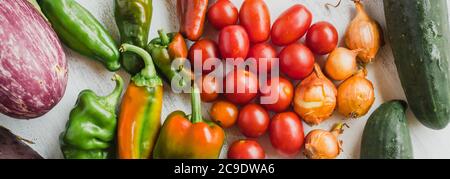 Assortment of vegetables, including: tomato, onion, peppers, cucumber and aubergine Stock Photo