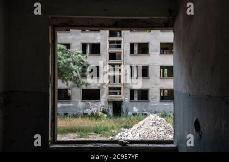 Elstal, Germany. 27th July, 2020. View from a former apartment of the Soviet army on the area of the Olympic village in Elstal in Brandenburg. Since January 2019, property developer terraplan from Nuremberg has been refurbishing the listed Speisehaus der Nationen including the former boiler house, the future Haus Central. Furthermore, further new residential buildings are being constructed around these buildings. A total of around 365 apartments will be built in the first construction phase until 2022. Credit: Paul Zinken/dpa-Zentralbild/ZB/dpa/Alamy Live News Stock Photo
