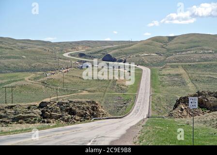 view of historic route 30winding through hills in western wyoming Stock Photo